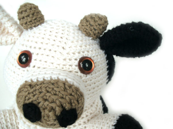 close-up shot of the face of a crocheted cow, made with the Jackie the Cow pattern