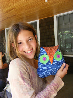 Ten Tips for Sewing with Kids - proud kid with an owl she sewed herself
