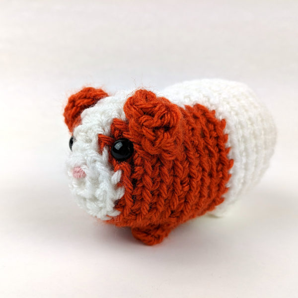 crocheted guinea pig with bobble stitch feet
