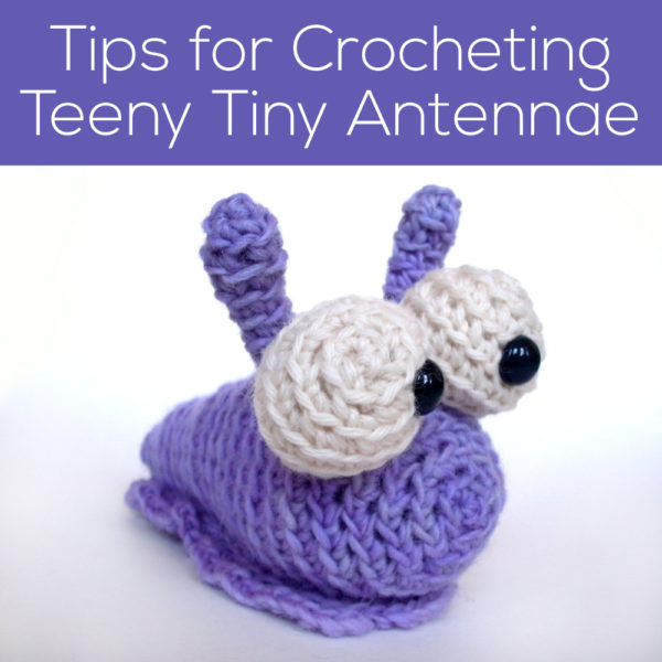 How to crochet skinny parts like legs and antennae - showing a crocheted purple slug with antennae as an example