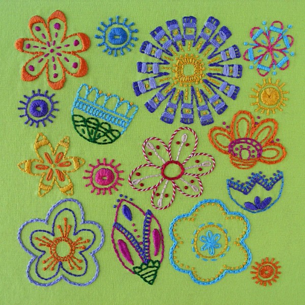 Bloom embroidery pattern cover showing lots of colorful embroidered flowers, including several using pistil stitch.