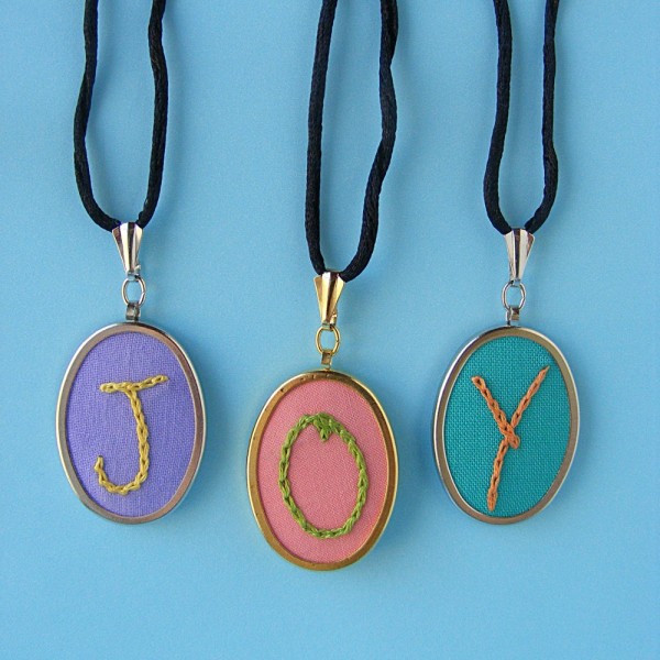 Three pendants showing the letters JOY - showing how to chain stitch for letters. Uses the Joy ABC embroidery pattern
