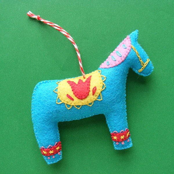 felt dala horse Christmas ornament with embroidery and whip stitch applique decorations - made with a pattern from Shiny Happy World