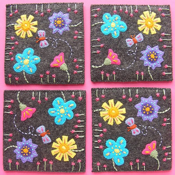 set of four stitched felt coasters with flowers and butterflies - made with a free pattern from Shiny Happy World