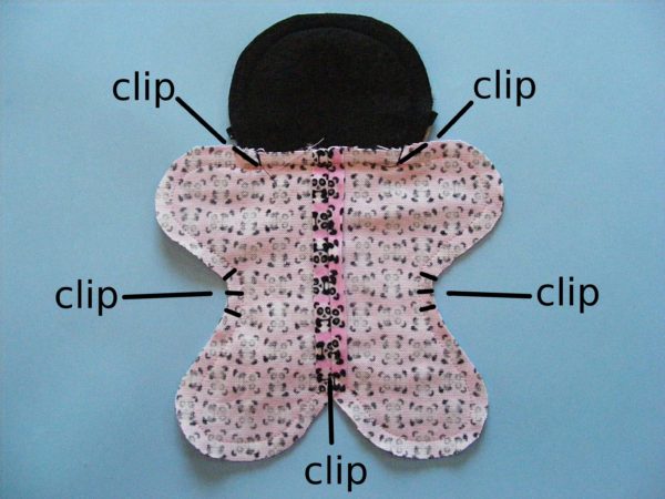 partially sewn doll body with clipping locations indicated