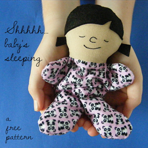 Small beanbag doll in a child's hands - free doll pattern Itty Bitty Sleepy Baby