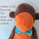 stuffed monkey wearing a bowtie made with the free bowtie pattern from Shiny Happy World