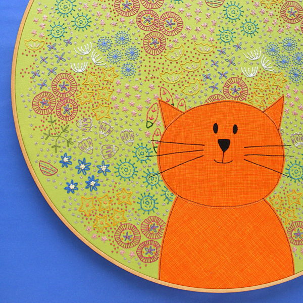 A BIG embroidery project! This cat surrounded by embroidered flowers is in an 18 inch hoop!