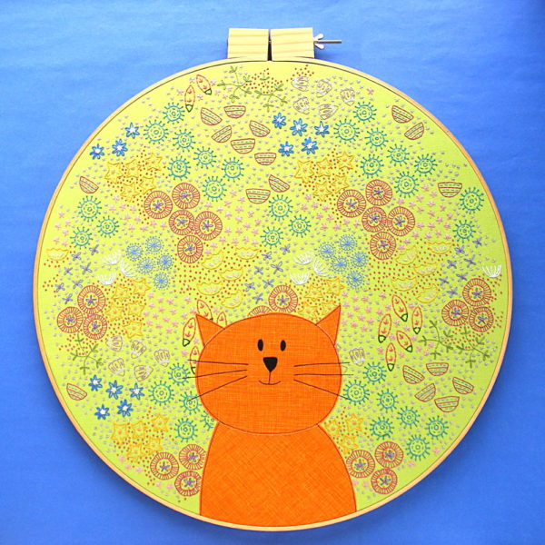A BIG embroidery project! This cat surrounded by embroidered flowers is in an 18 inch hoop!