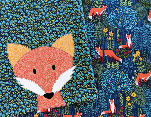 Finished receiving blanket made with a free pattern - plus an added fox applique face.