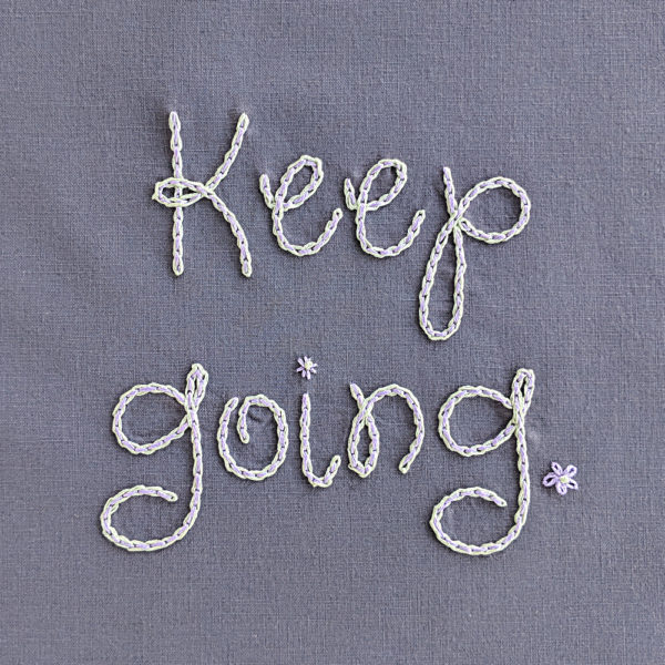 Keep going. A stitched reminder from Shiny Happy World.