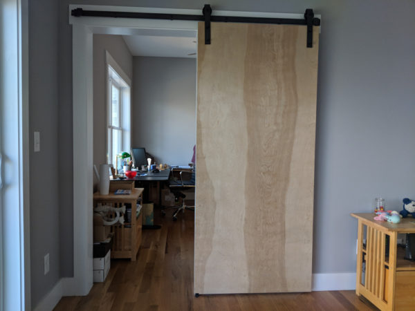 barn door before upholstering with improv quilt - Shiny Happy World
