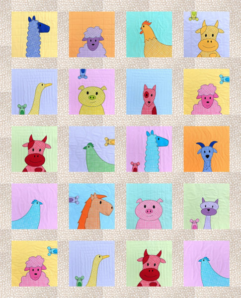 Pastel farm animals applique quilt with sashing between all the blocks