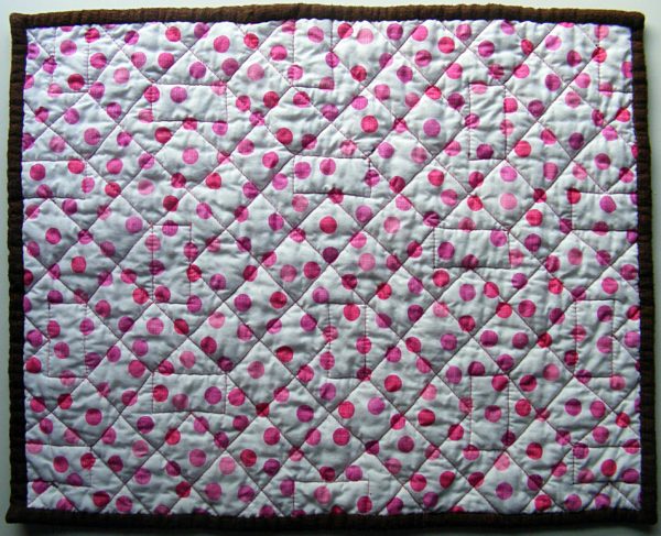 doll quilt back showing the quilting lines