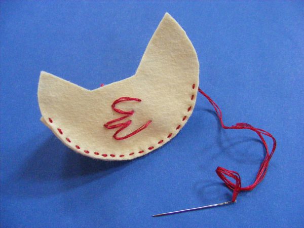 partially sewn felt hen