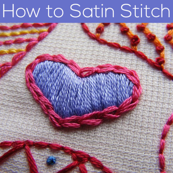 Small heart embroidered with satin stitch in purple thread, outlined with chain stitch in pink thread. Text reads: How to Satin Stitch