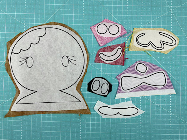 printed gingerbread applique pieces fused to fabric