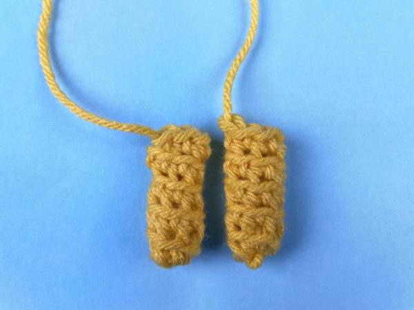 two crocheted yellow bee antennae - part of a free crochet pattern 