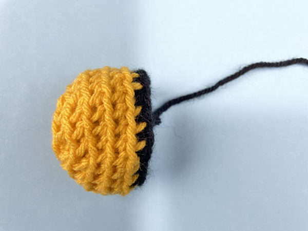 crocheted bee head - one step in a free crochet pattern from Shiny Happy World
