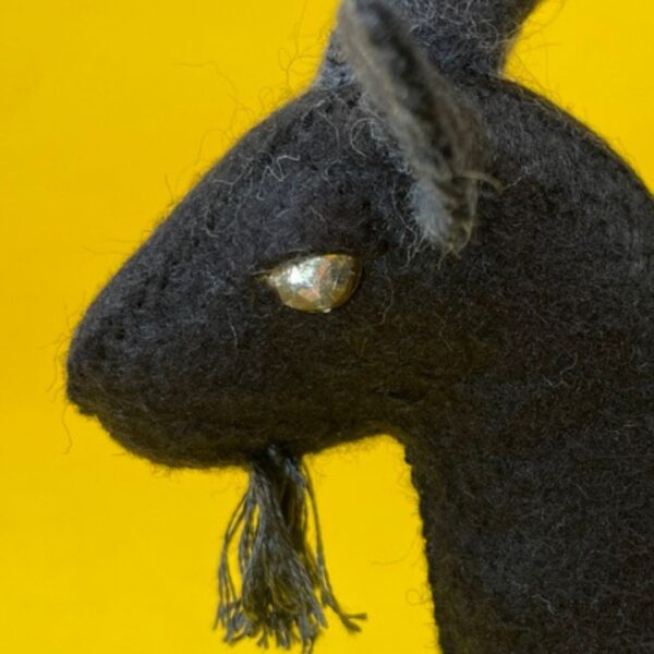 Felt Goat - Black Phillip from the movie The Witch, made with black felt and gold rhinestone eyes.