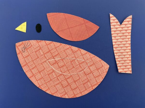 Bird applique pieces with placement and stitching lines traced onto the fabric.
