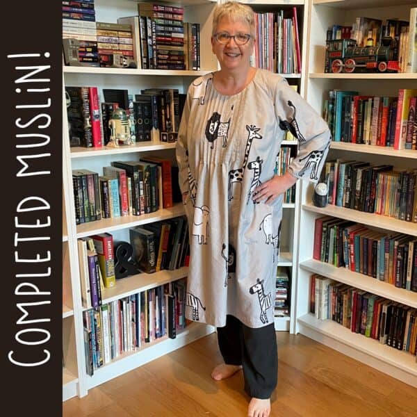 Finished muslin of a pintuck dress pattern, gray fabric with quirky print of African animals
