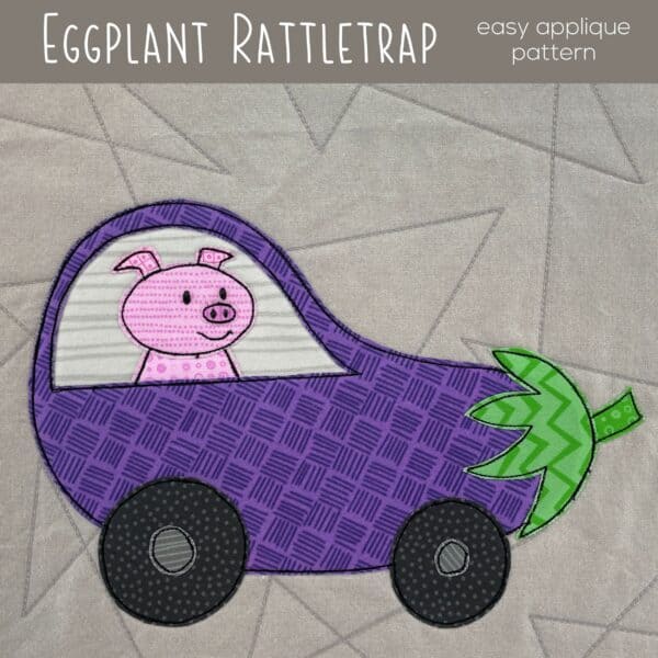 Colorful eggplant-shaped toy car with a pig inside, applique quilt block.